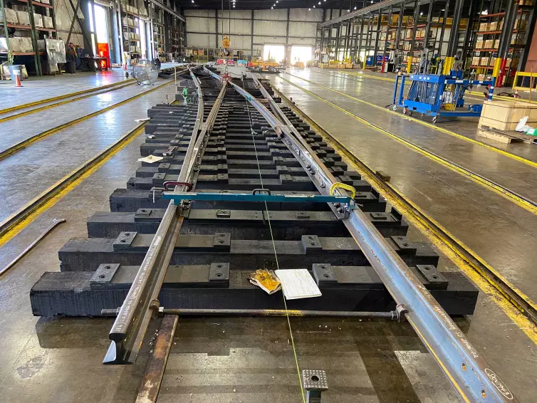 crossing railroad track in a warehouse.