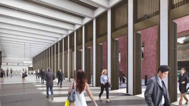People walking through Bond Street station.