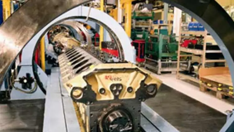 Heavy conveyor line moving an engine.