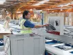 People packing clothes from a conveyor system