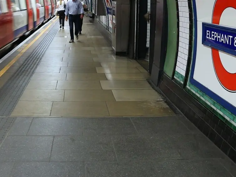 people on the platform at Elephant and Castle underground station.