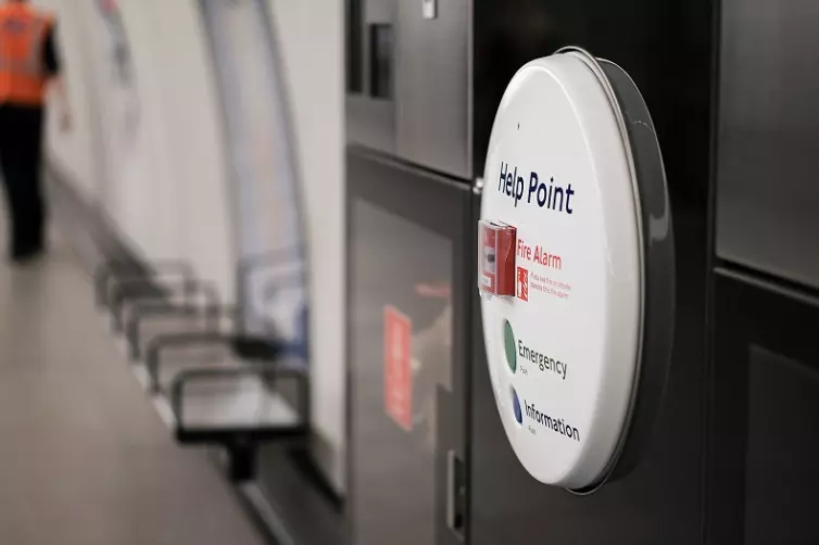 help point with fire alarm and emergency button in Elizabeth line underground station.