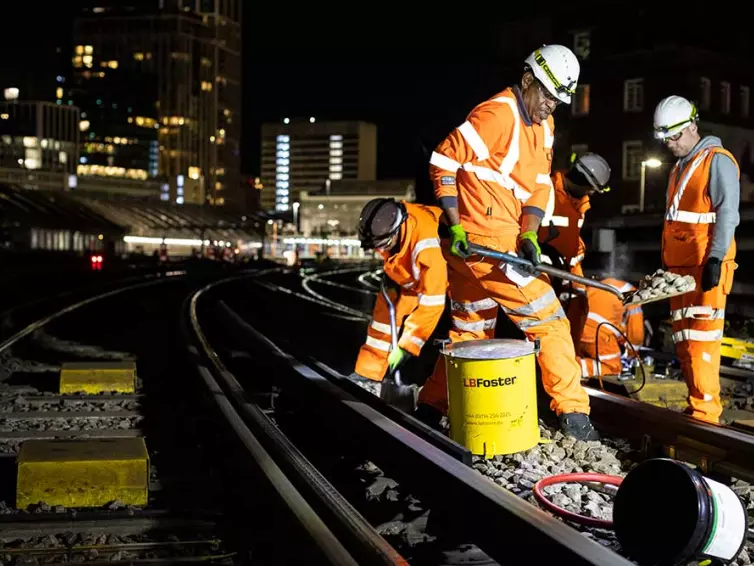 installation of pw lubrication system outside of waterloo station by men in hi vis clothing.