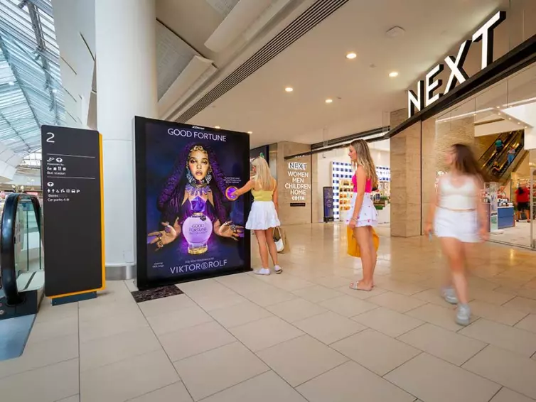 Interactive advertising display in shopping centre.