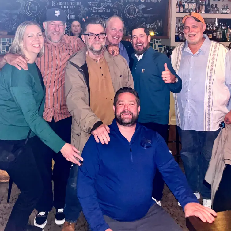 Group of people smiling.
