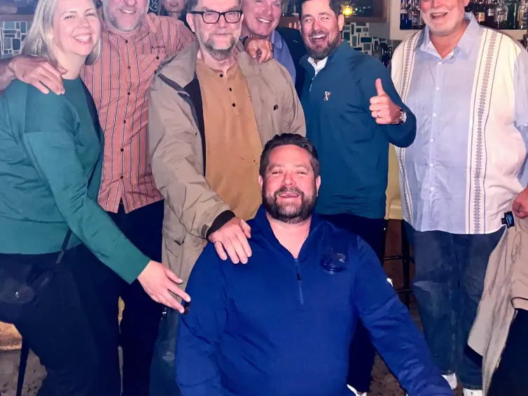Group of people smiling.