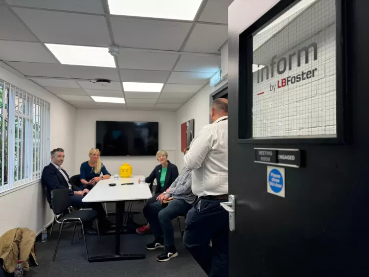 (L-R) James McGowan, RIA (Railway Industry Association), Elisa Rees-King, RIA (Railway Industry Association), Lilian Greenwood, Nottingham South Member of Parliament, and David Clarke, Director of Sales & Marketing, Technology Services and Solutions, sit in a L.B. Foster conference room.