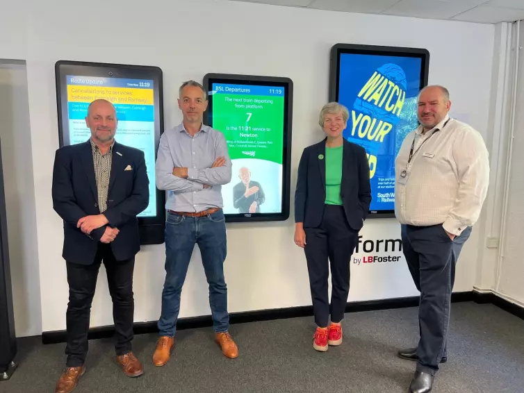 (L-R) Anthony Thompson, Senior Business Development Manager, Dagan Bradbury, Head of Inform, Lilian Greenwood, Nottingham South Member of Parliament, and David Clarke, Director of Sales & Marketing, Technology Services and Solutions, pose in front of L.B. Foster Inform Totems.