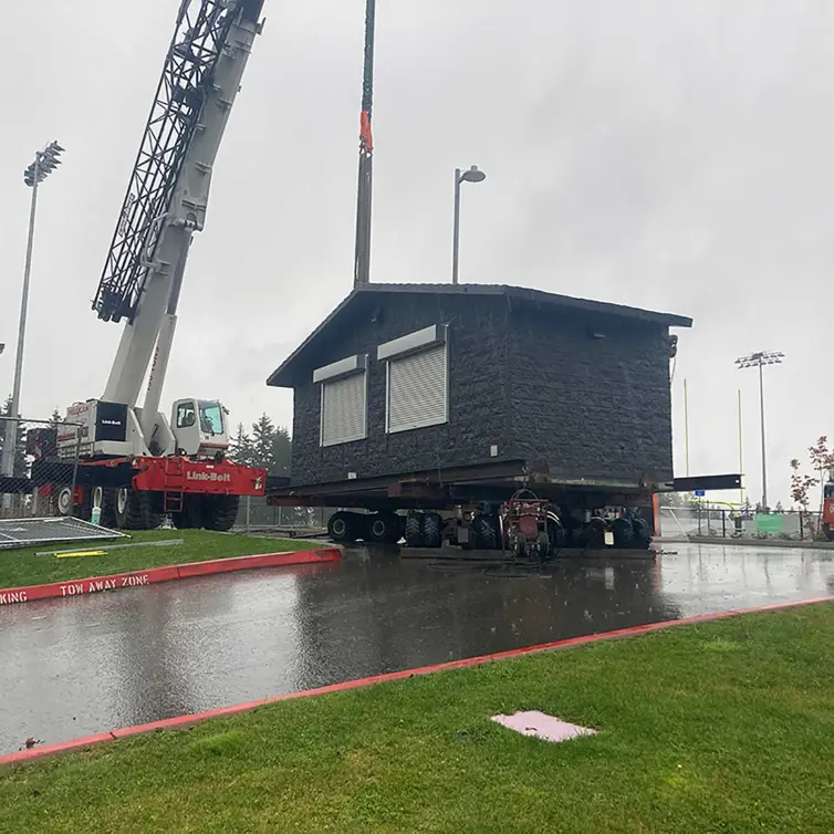 Nampa 5 section building on crane.