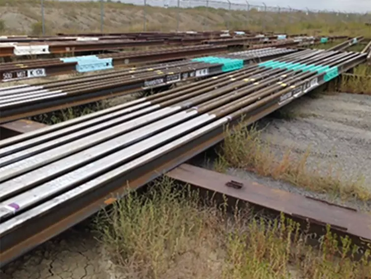 a pile of transition bonded rail.