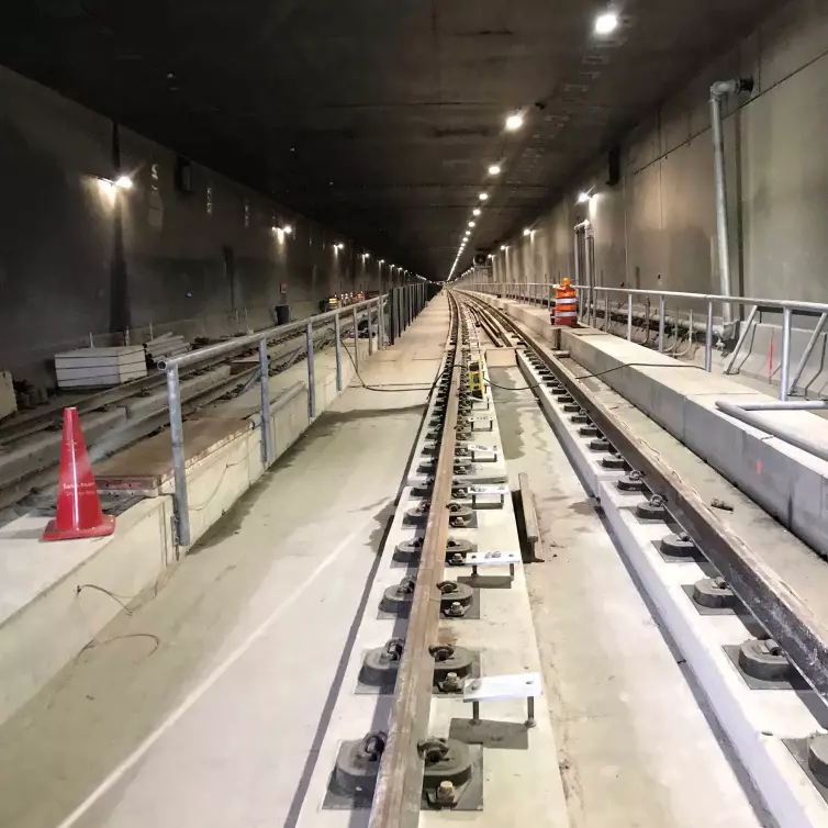 rail fasteners on track in subway tunnel.